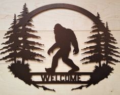 a metal sign that says welcome with a silhouette of a man on a skateboard