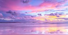 the sky is reflected in the wet sand