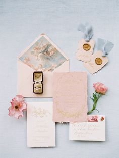 the wedding stationery is laid out and ready to be put into the bride's bouquet