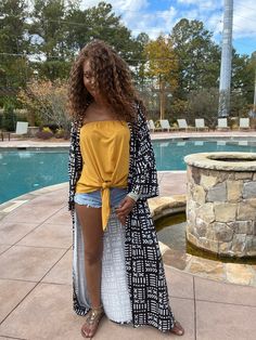 Looking for something unique and eye-catching? Check out our Danai Black Mud Print Long Sleeve Kimono! This beautiful piece is inspired by African mud prints, and is sure to turn heads wherever you go. The loose fit and long sleeves make it perfect for a variety of body types, and the ankle-length hem adds a touch of elegance. Dress it up or down, depending on your mood – either way, you're sure to look amazing! Product Details Material: 100% polyesterBelt: NoFit: loosePattern : PrintedShipping: Long Black Printed Kimono, Black Bohemian Long Cover-up, Printed Long Kimono For Beach Cover-up, Printed Cotton V-neck Kimono, Summer Bohemian Long-sleeved Duster, Elegance Dress, Long Sleeve Kimono, Ankle Length, Body Types