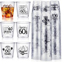 six clear cups with black and white lettering on the side, each containing different types of drinks