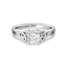 a white gold engagement ring with a princess cut diamond in the center and an intertwined band