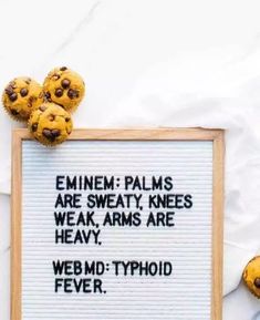 a sign with some cookies on top of it that says, emiem - palms are sweaty knees weak arms are heavy