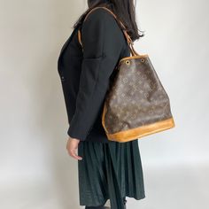 Go big with the Louis Vuitton Vintage Monogram Noe Large bag. Its spacious design and iconic monogram pattern make it perfect for carrying all your essentials. Plus, the Noe feature ensures your items are secure and easily accessible. Time to elevate your style game! Condition Rating: Fair condition Condition Notes: Marks/stains to the leather, leather dried, corner wear, cracking to the leather trim, creasing/cracking to the strap, missing drawstring, tarnishing to the hardware, stains on the i Modern Monogram Canvas Shoulder Bag For Errands, Modern Monogram Canvas Shoulder Bag For Everyday, Louis Vuitton Vintage, Vintage Monogram, Monogram Pattern, Vintage Louis Vuitton, Carry All Bag, Large Bag, Fendi Bags