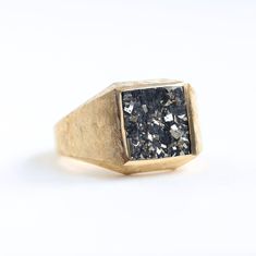 KEANU PYRITE SIGNET RING Stunning signet ring with pyrite crystal. DETAILS  Gemstone: pyrite Band width: approx. 14mm on the front  Finish: Polished
   Material:14k Gold: yellow, white, rose  18k Gold: yellow, white, rose  Other Metal: platinum  Sizing: We are using US metric system   CUSTOMIZATION OPTIONS This design can be made with gemstones of your choosing. If you would prefer a custom ring, please contact us before purchase. PROCEDURE INFORMATION Please select the material and ring size from the drop-down menu on the right side of the listing.
  SHIPPING INFORMATION Free Insured Shipping: The item will be gift wrapped and shipped with insured express shipping from Europe. Gemstone Rings Unique, Pyrite Ring, Bloodstone Ring, Mens Pinky Ring, Seersucker Suit, Mens Gemstone Rings, Metric System, Signet Ring Men, Pyrite Crystal