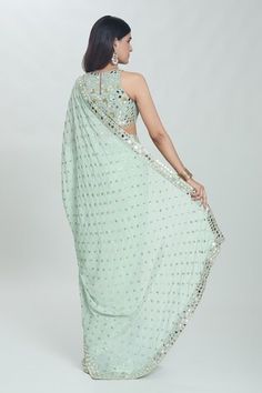 Sea green saree with all-over sequins buttis and sheesha hand embroidered borders. Comes with coordinating embroidered and padded blouse. - Aza Fashions Green Sleeveless Pre-draped Saree For Festive Season, Designer Pista Green Choli With Sequins, Pista Green Pre-draped Saree With Mirror Work For Navratri, Designer Pista Green Sequined Choli, Pista Green Sequined Choli For Designer Wear, Embellished Semi-stitched Saree, Festive Sleeveless Pre-draped Saree With Mirror Work, Bollywood Style Pre-draped Sleeveless Saree With Mirror Work, Semi-stitched Sleeveless Pre-draped Saree With Mirror Work