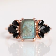 Add a bit of mystical magic to your ring stack with this stunning statement ring from La Kaiser. Featuring your choice of moody labradorite, bright pink cz, magical rainbow moonstone, earthy moss agate, or unique sunstone.Shop more black onyx and rose gold jewelry pieces at Local Eclectic. Local Eclectic, Onyx Crystal, Emerald Cut Rings, Sterling Silver Engagement Rings, Vermeil Jewelry, Labradorite Ring, Ring Black, Blue Fire, Black Jewelry