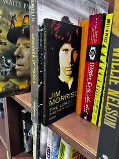 several books are on the shelves in a book store, with one being elvis presley