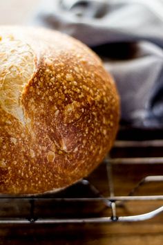 a loaf of bread sitting on top of a metal rack