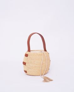 Do you want to look stylish and hippy? Get your hands on this handmade straw bag. It's high quality, eco-friendly, and handcrafted by women in Morocco. Its design is unique and timeless. Get yours now! we are proud to introduce our signature straw french bag to you. it is handmade by our talented artisan who has been working with us for years. this beautiful bag has a unique design that you would find nowhere else. the light and durable material are ideal for taking the bag on your adventures. S Straw Bucket Bag For Market, Bohemian Bucket Crochet Bag For Vacation, Handwoven Natural Bucket Bag For Beach Season, Bohemian Crochet Bucket Bag For Vacation, Natural Handwoven Bucket Bag For Beach Season, Bohemian Bucket Bag For Vacation In Natural Color, Bohemian Natural Bucket Bag For Vacation, Bohemian Beige Bucket Bag, Bohemian Bucket Straw Bag For Travel