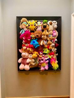 there are many stuffed animals on the wall