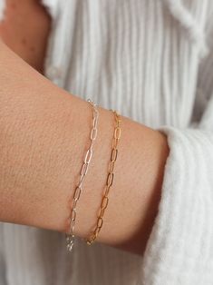 This paperclip chain bracelet is the perfect accessory to complete that minimalist modern look! Look no further for your everyday wear jewelry. Great to give as a gift or to treat yourself! --------------------------- D E T A I L S * Choice of sterling silver or 14k gold-fill bracelet / Anklet - Great for those sensitive to specific metals * Paperclip links measure 2mm x 5mm * Ethical sourcing of all materials * Packaged neatly + securely in a reusable drawstring bag - ready to gift! ----------- Silver Paperclip Bracelet With Delicate Chain, Modern Paperclip Bracelet With Delicate Chain For Everyday, Silver Delicate Chain Paperclip Bracelet Gift, Modern Everyday Paperclip Bracelet With Delicate Chain, Delicate Chain Paperclip Bracelet As Gift, Delicate Paperclip Chain Bracelet As Gift, Delicate Paperclip Chain Bracelet Gift, Everyday Minimalist Paperclip Bracelet With Adjustable Chain, Delicate Everyday Paperclip Bracelet