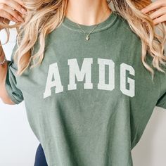 Catholic AMDG Shirt Distressed Catholic Teeshirt Catholic Gift Her Catholic Gift Teen Comfort Colors Shirt Catholic Subtle Catholic Shirt - Etsy Casual College Tops With Lettering, Casual Tops With Lettering For College, Comfortable Cotton Tops For College, Green Cotton T-shirt With Lettering, Green Top With Lettering And Relaxed Fit, Green Top With Lettering In Relaxed Fit, Cotton Tops With Lettering For College, Green Relaxed Fit Top With Lettering, Cotton Tops With Lettering For Loungewear