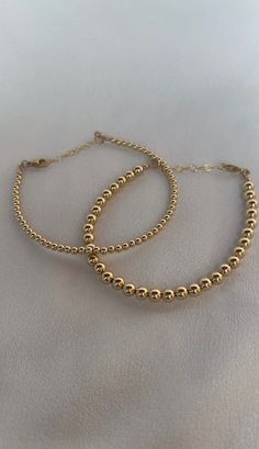 Handmade 14k Gold filled bracelets, perfect everyday wear or special occasions and a wonderful  Gift for Mom, Wife, Friend, Sister, Grandmother and Daughter. HOW TO ORDER 1. First, select your desired metal in the drop down box 1. Then, select your bracelet size and add to cart! BRACELET MEASURING GUIDE: Average Women's Sizing: 5-6.5 inches = extra small 6.5-7 inches = small 7-8 inches = medium 8 inches+ = large *We recommend ordering a size that is roughly 1/2 inch - 1 inch larger than one's actual wrist size for a comfortable fit. Our chain bracelets come with a 1" extension piece so the fit can be adjusted further. let us know if you'd like to omit the extender in the notes to seller.  HOW TO MEASURE: grab a string and wrap it around your wrist, then measure the string with ruler or mea Gold Bead Bracelet, Cotton Jewelry, Gold Bracelet Set, Bracelet Stacking, Gold Bead Bracelets, Wife Gift, Gift For Friend, Gift For Wife, Bracelet For Women