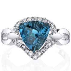 Meet us in London Melt into the precious moments of your day (and night) with the sweet whispers of our London Blue Topaz. This versatile ring features a triangle shape Peora natural London Blue Topaz gemstone in 14K white gold. Our natural London Blue Topaz gemstones are a unique gift from nature. By cutting them in a way that respects the rough's natural radiance, we ignite their inherent intensity and maximize their brilliance to deliver on our signature Peora standard. Handcrafted in pure 14 Topaz Birthstone Ring, London Topaz, Topaz Birthstone, Blue Topaz Bracelet, Blue Topaz Gemstone, Amber Ring, Gemstone Engagement, The Triangle, Round Stud Earrings