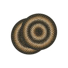 a black and tan rug with two circles on the bottom, one circle has been made from