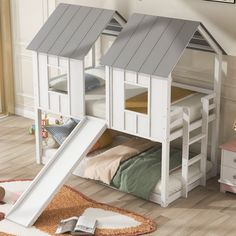 a child's bedroom with bunk beds and a slide in the floor next to it