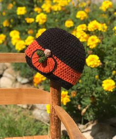 "This black and orange beanie embellished with a pumpkin appliqué is fall perfection! All hand made from my original design, this hat is warm and fun. This hat is made in acrylic yarns. Please select desired size. Hat sizing info: 0-3 months: 15\" circumference 3-6 months: 17\" circumference 6-12 months: 18\" circumference 12 months-2T: 19\" circumference 3T-4T: 20\" circumference 4T-tween: 21\" circumference adult small: 22\" circumference adult medium: 23\" circumference adult large: 24\" circ Adjustable Hand Knitted Crochet Hat For Fall, Adjustable Black Crochet Hat For Fall, Black Knitted Hat For Halloween, Handmade Fitted Crochet Hat For Fall, Cute Adjustable Black Crochet Hat, Handmade Beanie For Fall, Pumpkin Hat Crochet, Orange Beanie, Orange Accessories