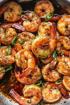 cooked shrimp in a pan with herbs and seasoning