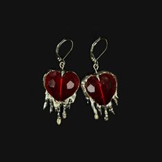 Handmade earrings with brilliant red crystal hearts and soft solder details. Inspired by the heavily encased jewels in metalwork of the Middle Ages, these reference the motif of the bleeding heart, and popular jewelry styles of the period. Hypoallergenic silver plated french earring hooks Made to order; will be unique and vary from product photo Silver Red Jewelry, Sterling Silver Heart Jewelry For Party, Red Drop Jewelry With Matching Earrings, Heart Pendant Sterling Silver Jewelry For Party, Sterling Silver Heart Pendant For Party, Pierced Metal Heart Pendant Jewelry, Red Drop Beads For Jewelry Making, Pierced Heart Pendant Jewelry, Red Drop Earrings For Valentine's Day