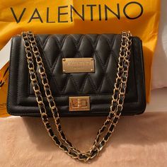 Valentino Milano Alice Va 6118, Black Bag With Tag, Brand New. - Authentic - Genuine Leather - Convertible Leather Woven Chain Shoulder Strap - Fold Ever Flap With Turn Lock Closure - Center Zip Compartment - Three Inside Open Pocket - One Inside Zip Pocket - Fabric Lining - Black Leather - Includes Dust Cover - Made In Italy Valentino Bag Handbags, Valentino Rockstud Bag, Valentino Crossbody Bag, Valentino Jeans, Valentino Purse, Valentino Bag, Valentino Handbags, Vintage Valentino, Dress Leopard