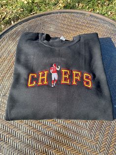 Chiefs Kelce Embroidered Crewneck Sweatshirt Fall College Embroidered Tops, Embroidered Fall Tops For College, Embroidered Long Sleeve Tops For College, Black T-shirt With Embroidered Logo For Fall, Black Embroidered Logo T-shirt For Fall, Black Crew Neck Top With Letter Embroidery, Black Embroidered Crew Neck Sweatshirt, Fall College Embroidered T-shirt, Black T-shirt With Custom Embroidery For Fall