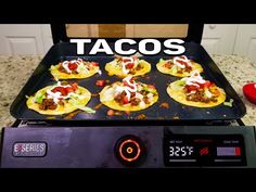 tacos being cooked on an electric griddle with the words taco's over it