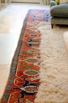 the rug on the floor is very long and has many colors to choose from,