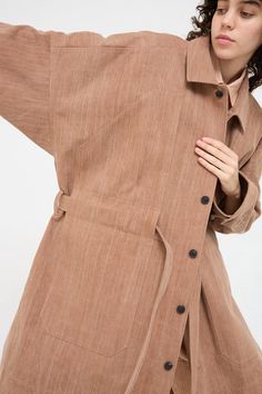 Woven Cotton Long Coat in Brown - Oroboro Belted Beige Cotton Outerwear, Linen Single Breasted Outerwear With Spread Collar, Single Breasted Linen Outerwear With Spread Collar, Linen Single-breasted Outerwear With Spread Collar, Linen Outerwear With Spread Collar And Buttons, Cotton Belted Outerwear With Lapel Collar, Spring Linen Outerwear With Spread Collar, Belted Linen Long Sleeve Outerwear, Belted Long Sleeve Linen Outerwear