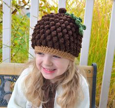 This crochet pattern comes with complete instructions and illustrations for this adorable Acorn or Pine Cone Hat, make one up just in time for Thanksgiving or Christmas. The pattern is for newborns up to adult.  Skill Level: Intermediate Stitches Used:  Chain, Single, Half Double, Double,Puff Stitch (tutorial included for puff stitch), Slip Stitch Materials Needed: Size I (5.5mm) Crochet Hook Yarn Needle / Scissors Worsted Weight Yarn If you love this design and would like to stay up to date, kn Crochet Squirrel, Acorn Hat, Crochet Character Hats, Crochet Friends, Crochet Holiday, Hat Crochet Pattern, Bonnet Crochet, Festival Hat, Crochet Leaves