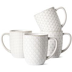 three white coffee mugs stacked on top of each other