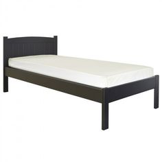 a black bed frame with white sheets on it