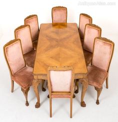 a dining room table with six chairs around it