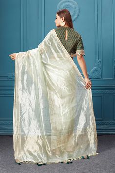 Look royal on weddings and festive occasions in this alluring pista green tissue Kora silk saree. It comes with a beautiful dark green printed and embroidered saree blouse. Embroidered Saree Blouse, Kora Silk Sarees, Pista Green, Embroidered Saree, Green Saree, Banarasi Sarees, Indian Sarees, Saree Blouse, Pure Silk