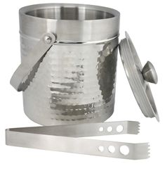 a stainless steel ice bucket with tongs next to it and a pair of scissors