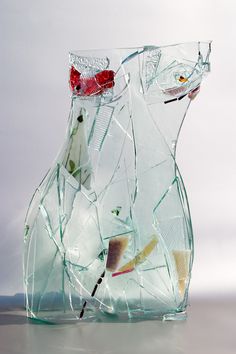 a broken glass vase sitting on top of a table