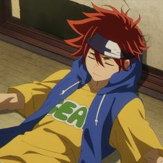 an anime character with red hair sitting on the floor