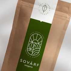 a brown paper bag with a green logo on the front and white stripe around it