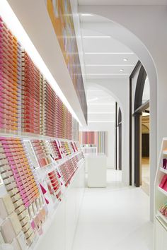 the interior of a cosmetics store with rows of shelves