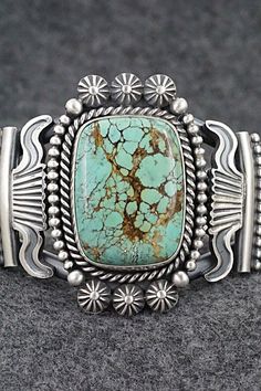 This stunning natural Number 8 turquoise and sterling silver bracelet was made by Navajo silversmith Michael Calladitto. The inside is signed Michael Calladitto and stamped Sterling.Size: 5 3/4" (will fit up to a 7" wrist)Gap: 1 1/4"Width: 1 7/8"Cuff Width: 5/8"Free shipping on all orders! We ship with USPS and always include tracking. All orders ship within a day of payment.Returns are accepted up to 30 days after you receive your order. Just send us a message. Our shop offers cash back or stor Western Silver Bracelet With Patina, Unique Stamped Turquoise Jewelry, Handmade Western Turquoise Bracelets, Handmade Western Turquoise Bracelet, Handmade Western Style Turquoise Bracelet, Unique Engraved Turquoise Bracelets, Handmade Turquoise Sterling Silver Western Bracelet, Western Turquoise Jewelry With Patina, Handmade Turquoise Sterling Silver Southwestern Bracelet