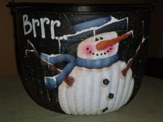 there is a snowman painted on the side of this trash can that says brrr