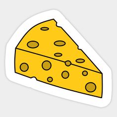 a piece of cheese sticker sitting on top of a white surface with black dots