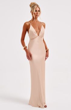 Made in our super luxe. bias cut hammered satin with a gorgeous sheen. the Anja maxi skims the body for a beautiful fit. The perfect dress to create memories in. it features a plunge V-shaped neck and delicate straps.   Colour: Champagne. Luxury bias cut satin. Delicate straps. Skims over the figure. Plunge neckline. Maxi length. Model is an XS and is wearing an XS. Homecoming Dresses Corset, Pink Monochrome, Midi Dress Wedding Guest, Long Sleeve Homecoming Dresses, Maxi Dress Sale, Create Memories, Sparkle Dress, Plunge Neckline, Dresses By Length