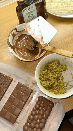 there are chocolates and peanut butter on the table next to some other food items