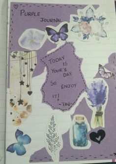 a purple journal with flowers and butterflies on the page, which says today is your day so enjoy it