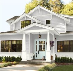 the front view of a house with white trim