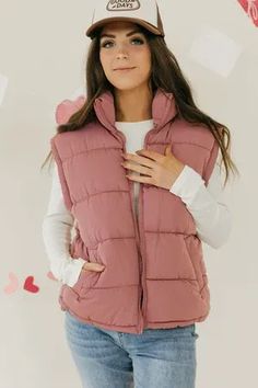 Stay comfy and stylish with our Carlyn Vest-Mauve. This puffer vest features a convenient zip up closure and practical pockets for all your essentials. Perfect for adding a playful twist to your outfit.