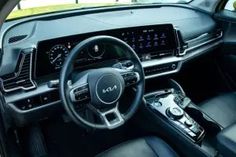 the interior of a car with steering wheel and dashboard