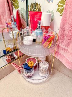 a bathroom counter with various items on it and a mirror in the backround