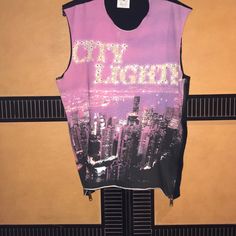 Authentic D&G Brand Top, 100% Cotton With Crystals Embellished On The “City Lights” Imprint. The Back Is Black With A Purple Logo At The Neckline. Has Side Zippers With The Logo On The Zipper Pulls. Pink Sleeveless Top For Streetwear, Purple Graphic Print Sleeveless Tops, Purple Sleeveless Graphic Print Top, Purple Sleeveless Top With Graphic Print, Trendy Purple Sleeveless Top, Sleeveless Cotton Top For Night Out, Purple Sleeveless Tank Top For Night Out, Purple Sleeveless Top For Night Out, Sleeveless Purple Top For Night Out